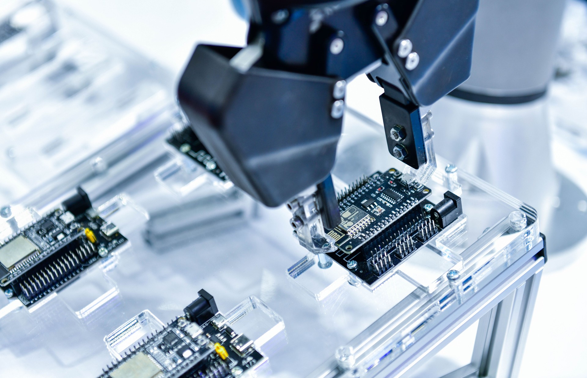 Modern Robot Arm automation system moving circuit boards in a factory